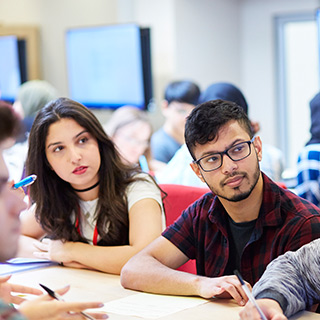 Students in class looking at a screen