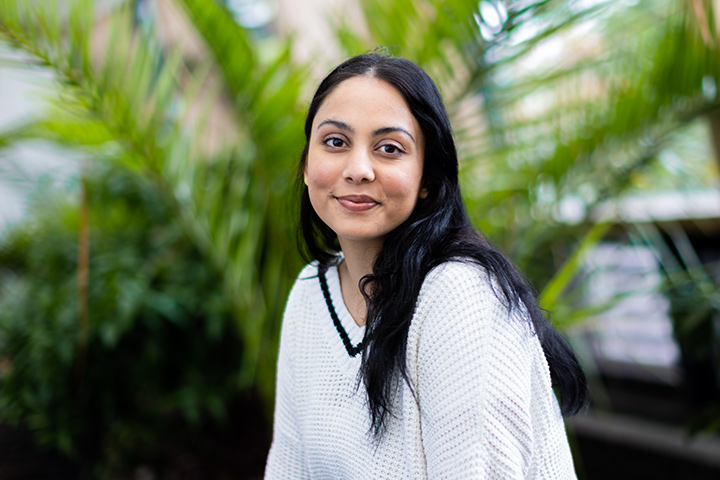 A student smiling at the camera