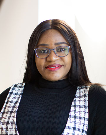 A student smiling at the camera