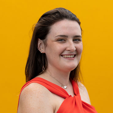 A student smiling at the camera