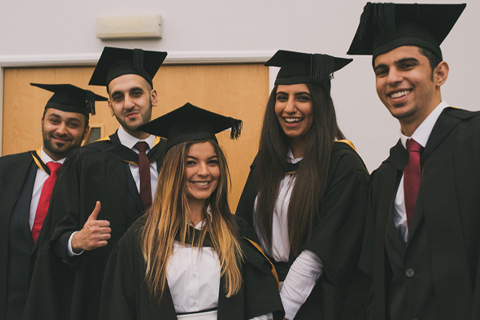 University graduands wearing mortarboards and gowns.