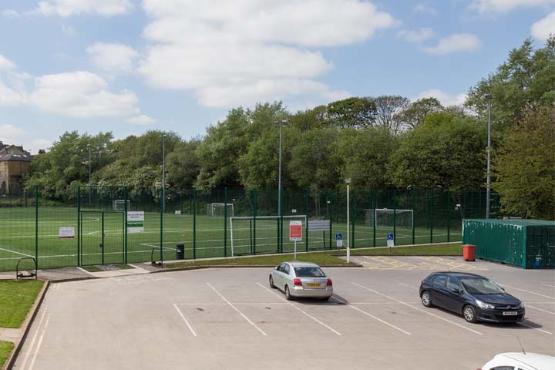 A car park on Laisteridge Lane, next to a 5G football pitch