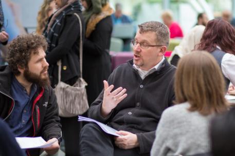 A group of postgraduate students in discussion