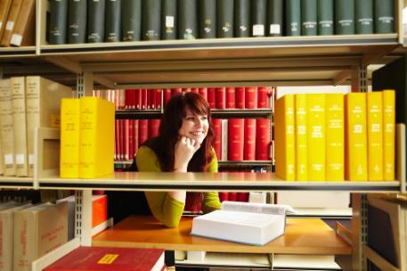 Library girl with bright books