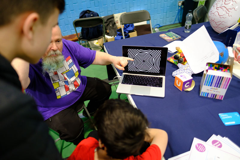 University colleague engaging children in a vision game - part of UNIfy Festival 2024