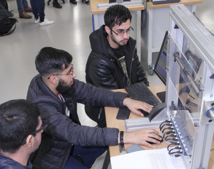 Civil Engineering students testing beam bending