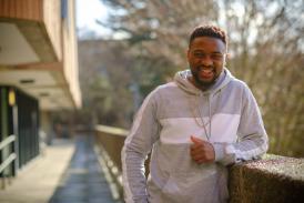 scholarship recipient Gideon stood outside student central