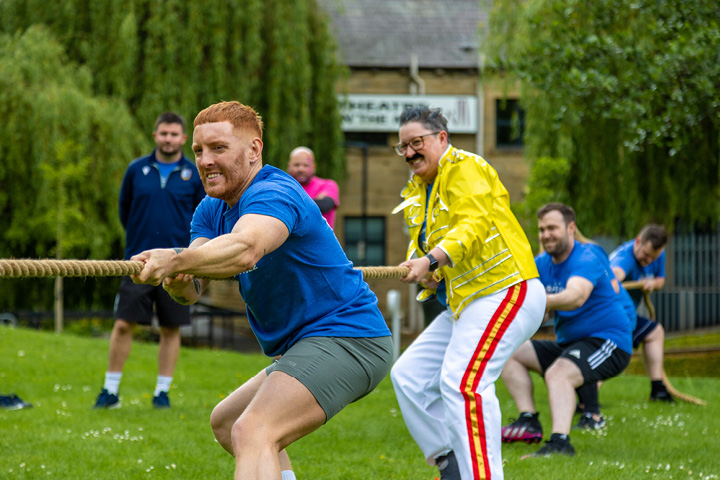 People playing tug of war at Team Bradford Festival 2022.