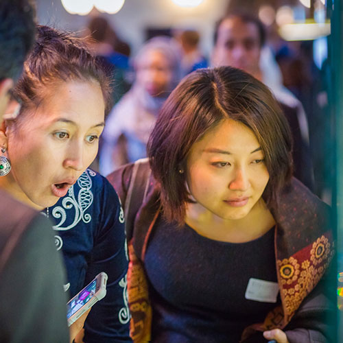 City Hall visitors looking at an exhibit