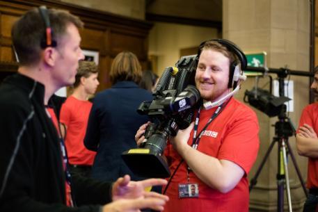 Atudent with television camera working in BBC Children in Need live broadcast