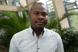 Olushola Adeborode Kolawole profile image with a tree in the background