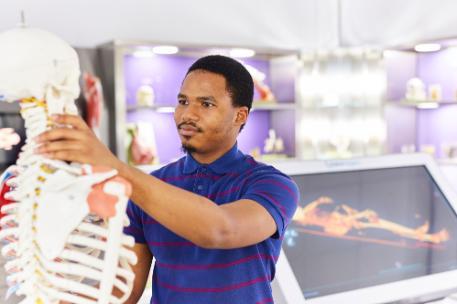 A Life Sciences student in a simulation suite