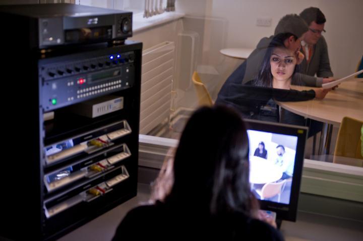 A student in the psychology observation lab