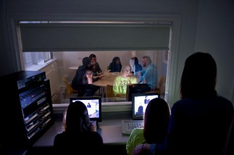 Psychology students observing a group discussion