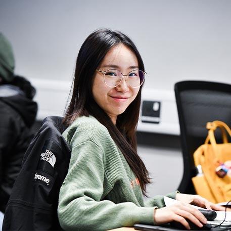 A student smiling at the camera.