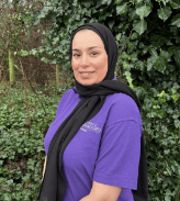 Staff member Fariya standing in the nursery garden